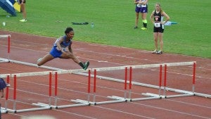 Cumberland High School’s Annesha Harris jumps over a hurdle at the VHSL 1A Track and Field Championships. (Photo by Cumberland Athletics)