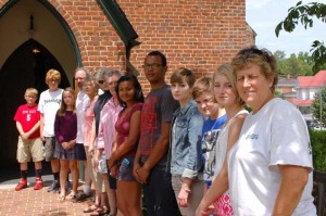 There was a line gathered Friday afternoon in front of Johns Memorial Episcopal Church in Farmville to ring the bell in recognition of the victims in Charleston’s Emanuel African Methodist Episcopal (AME) Church shooting. (Photo by Rob Chapman)