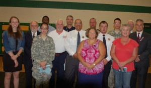 Pictured, members of the Buckingham community, along with the Buckingham County High School Student Council Association, remembered and memorialized the victims by holding a Patriot’s Day Celebration. Pictured are, from left, front row, Breanna Bagby, Mary Stearrett, Kathy Midkiff, Dr. Cecil Snead, second row, Ashley Hellerstedt,  Rudolph Roethel, Kerry Flippen, Wallace Goode, Hunter Wharam, back row, Michael Mabry, Chris Davis, William G. “Billy” Kidd Jr., Ronnie Bagby and E.A. “Bill” Talbert. (Photo by Jordan Miles