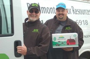 Piedmont Senior Resources drivers, from left, Jim Christie and Bobby Gormus share the sentiment on each box of meals they deliver: “Made with love.”