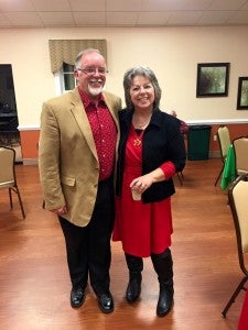 Rotarian Frank Lacey and wife, Mary, enjoy a festive evening with other Rotarians.