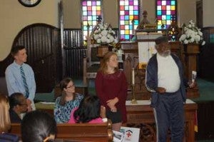 Rockingham students, from left, Jarrett Lilly, Madisyn Hess, Kayleigh Kibler and the Rev. Samuel Williams stop in at First Baptist Church on Rockingham’s Farmville Tour Guides project.
