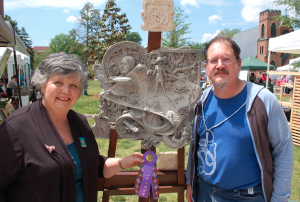 Andrew Lonon, right, won the Best in Show award at the festival. Pictured with Lonon is Martha Pennington Louis, who presented the award to the artist. He received $300 from Central Virginia Arts. The sponsor was the Town of Farmville.