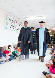 CARSON REEHER | HERALD Dr. David Smith, right, superintendent of Prince Edward County Schools, and Carolyn Jones, left, principal of the elementary school, helped to lead the seniors as they made the loop through the halls of the elementary school Friday.