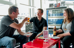 CARSON REEHER | HERALD Friends toast to LCVA’s Wine and Brew event. From left are Ben Jones, Greg Tsigaridas and Ashley Jones.