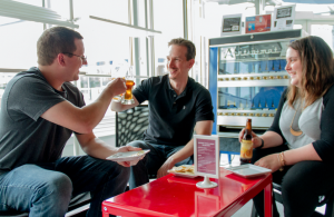 CARSON REEHER | HERALD Friends toast to LCVA’s Wine and Brew event. From left are Ben Jones, Greg Tsigaridas and Ashley Jones. 