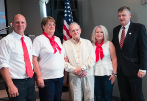 CARSON REEHER | HERALD Cindy Ott and Kat Short helped contact U.S. Rep. Robert Hurt so that Tucker could receive his wings, despite retiring a short two weeks before he would have been eligible. During the ceremony, led by Pastor Marv Fisher, Mayor Davis Whitus presented Tucker with his wings. Pictured are, from left, Fisher, Ott, Tucker, Short and Whitus.