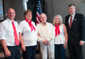 CARSON REEHER | HERALD Cindy Ott and Kat Short helped contact U.S. Rep. Robert Hurt so that Tucker could receive his wings, despite retiring a short two weeks before he would have been eligible. During the ceremony, led by Pastor Marv Fisher, Mayor Davis Whitus presented Tucker with his wings. Pictured are, from left, Fisher, Ott, Tucker, Short and Whitus. 