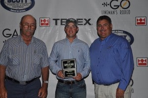 Mitch Dejarnette, middle, receives an award from Gaff-n-go Co-Chairmen C.T. Bryant and Maxie Rozell.