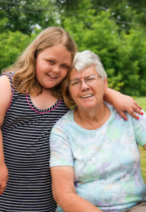 CARSON REEHER | HERALD Elaine Davenport poses with her granddaughter, Crista Hunt, who rode to school daily with Davenport.