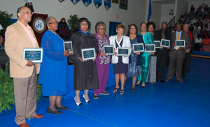 ITALIA GREGORY | HERALD Pictured are, from left, members and representatives of the Cumberland 10. Pictured are, Joe Washington, accepting for his sister, Gloria Washington, Ernestine Jones Monroe, LaVerne Reid Depte, Shirley White, Gwendolyn Lipscomb, the Rev. Kern Gilliam, Rosalind Gilliam, Yetta Anita Gilliam, the Rev. Robert R. Jones and George Reid, accepting for his brother, Samuel O. Reid. The honorees received framed copies of the plaques at gradation on May 20.