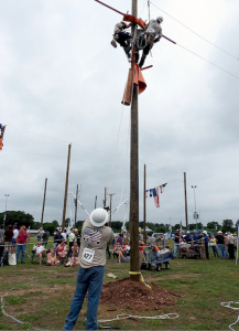 SEC’s journeyman lineman team of Blake Poindexter, Will Southworth and Nick Chumney competed in the Overhead Transformer Change-Out event as Gaff-n-Go attendees observed from a safe distance.