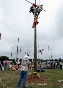 SEC’s journeyman lineman team of Blake Poindexter, Will Southworth and Nick Chumney competed in the Overhead Transformer Change-Out event as Gaff-n-Go attendees observed from a safe distance.  