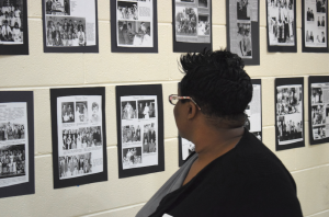 MARGE SWAYNE | HERALD A wall of fame — Pam Gray looks over a wall full of memories from Nancy Anderson Haga’s years of coaching Forensics and Debate at Prince Edward Academy/Fuqua School. 