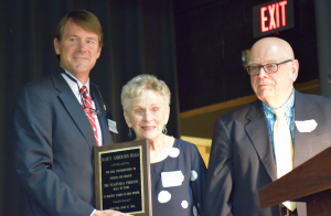 MARGE SWAYNE | HERALD Fuqua Head of School John Melton, left, and Dr. Robert Frank, right, recognize Nancy Anderson Haga as the first member of the Forensic Hall of Fame named in her honor.