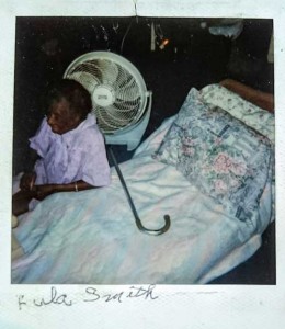 Alice Jones carries with her a Polaroid photo of the late Lula Smith, a Prospect resident, who died in a house fire in 1999. 