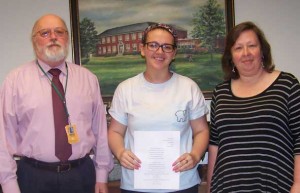 Members of the Woman’s Club Buckingham County GFWC attended the state meeting of the General Federation of Woman’s Clubs in Williamsburg. During the meeting, awards were presented for the writing contest. Emily Vaughan, a high school student, received a first-place blue ribbon for her poetry. Pictured are, from left, Buckingham High School Principal Rudolph Roethel, Vaughan and teacher Michelle Wright.