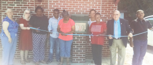 The Friends of the Farmville Library held a ribbon cutting event on June 30 for their fourth Little Free Library in Worsham. Pictured are, from left, Vicky Page, vice chair, Friends of the Farmville Library; Peggy Epperson, director of the Central Virginia Regional Library; Robyne Harris; Jay Patel, owner of Worsham Grocery; Shirley Harris; Vicky Morton; Dr. Odessa Pride, supervisor, Hampden District; Howard Simpson, chairman of the Prince Edward Board of Supervisors; and Tya Johnson, grandson of Danny Morton.