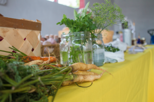 CARSON REEHER | HERALD Carrots and herbs sell fast at the Crickets Cove Farm and Forge booth.  