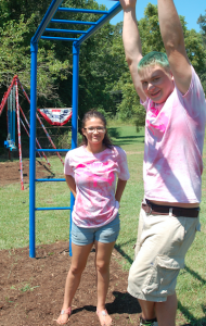 TITUS MOHLER | HERALD Seventeen-year-old Sean Murray, right, and fellow 17-year-old Alexx Swann stand on the playground on Church Street in Pamplin they helped restore.