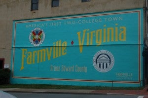 JORDAN MILES | HERALD A large mural, celebrating Farmville as America’s first two-college town, was painted in anticipation of the debate.