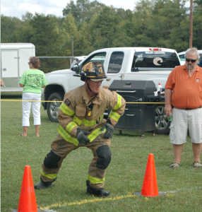 MARTIN L. CAHN A member of the Prospect Volunteer Fire Department takes off for his run in the 1-person forced entry event.