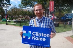 JORDAN MILES | HERALD Farmville resident John Burton holds a sign supporting candidates Hillary Clinton and Tim Kaine.