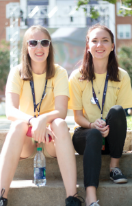 carson reeher | herald From left, Ann Polek and Taylor O’Berry take a break while volunteering with Jubilee festivities. Polek was one of 101 students to watch the debate from inside the Debate Hall.