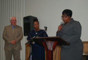 MARTIN L. CAHN | HERALD One of the afternoon’s five “Continuing the Legacy” honorees during Saturday’s banquet, Farmville Town Manager Gerald Spates, left, and Wendy Lyle-Jones listen to his introduction by Jacqueline B. Vaughan. Vaughan works in Spates’ office at town hall.