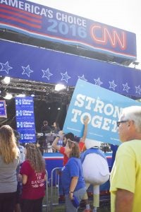 Students showed their support for Hillary Clinton and Tim Kaine by holding signs at the CNN stage during the network's broadcast. 