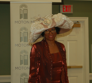 MARTIN L. CAHN | HERALD Moton Museum Family Challenge Chair Joy Cabarrus Speakes models a fancy hat during the event.