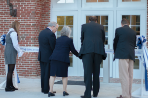CARSON REEHER | HERALD From left, Louise Waller, Marc Sharp, Wilma Register Sharp, President W. Taylor Reveley IV and Tim Pierson cut the ribbon for the two new residence halls at Longwood University.