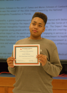 Soren Johnson is recognized as the winner of the 2016 Impact Award by the National Hemophilia Foundation in Florida.