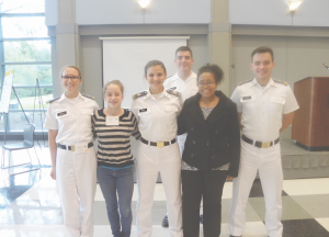 Cadets Alyssa Yonce and Caylor Scales pose with conference leaders.
