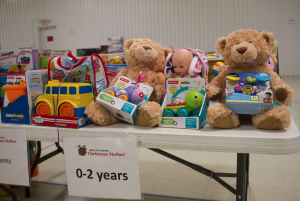 CARSON REEHER | HERALD Tables were set up to separate gifts by item and age group. This table shows toys appropriate for 0-2-year-olds.