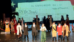 Six middle school students portrayed America’s Founding Fathers who stated the importance of Jesus Christ to our nation with their original words. Pictured are, from left, Chad Jones, Finn Jones, Cody Petersheim, Cally Vogel (Colonial “Hostess”), Addison Heslip, Matthew Davis and Davis Snoddy