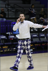 Longwood Assistant Director of Athletics Marketing Steve Robertson gets the crowd primed for the Diaper Derby during halftime of the men’s basketball game Jan. 19 in Willett Hall.