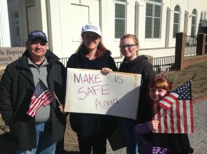JORDAN MILES | HERALD Cumberland residents, from left, Chris, Diana, Olivia, and Abigail Shores attended the rally Saturday, supporting President Donald Trump’s actions, including his wanting to build a wall at the border of Mexico.
