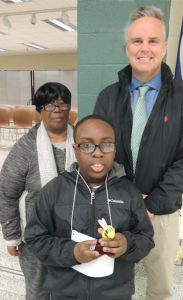 Division Spelling Bee winner Chance Woodson, front, a sixth-grader at Buckingham County Middle School, holds his “bee” award with Dr. Cecil Snead, division superintendent and his proud grandmother, Rozena Woodson.
