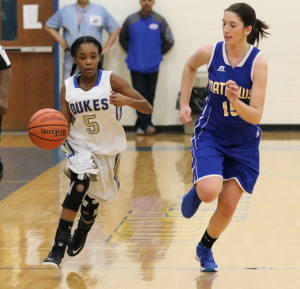 TITUS MOHLER | HERALD Cumberland High School junior guard Olivia Sims, left, pushes the ball up the court Friday night during the Conference 42 tournament championship game.