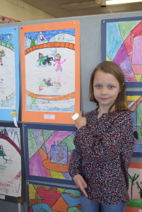 Third-grader Evelyn Johnson shows off her work.