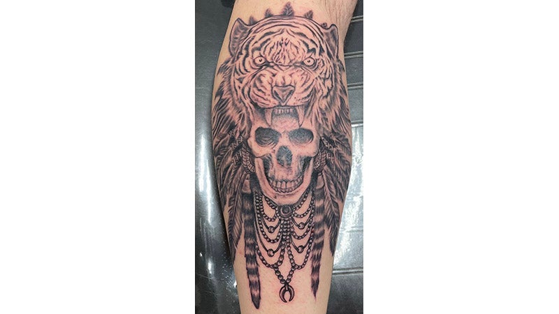 Tiger on a skull tattoo - Tattoogrid.net